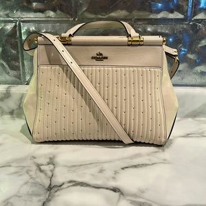 Coach grace bag with quilting and rivets